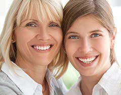 Two smiling women outdoors