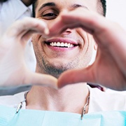 Patient creating a heart symbol with their hands