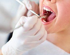 Closeup of patient receiving dental exam