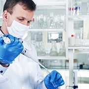 Dentist applying antibacterial coating for dental implants in Oklahoma City 