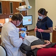 Dr. Isaacson treating patient