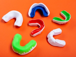 Series of mouthguards resting on a table