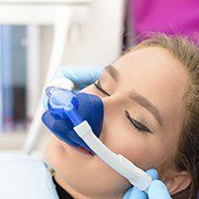 Woman with nitrous oxide nasal mask