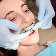 Woman being fitte for occlusal splint
