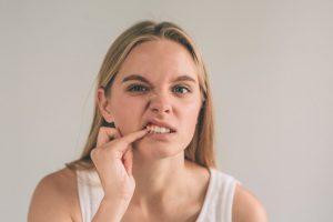 girl looking at her gums